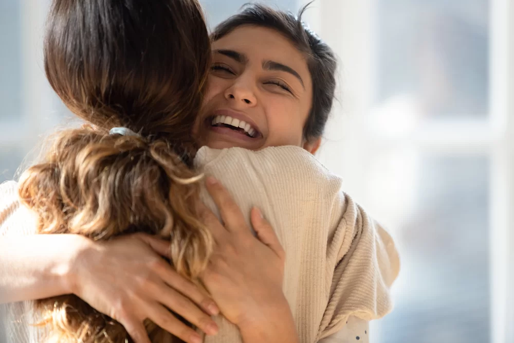 Two people hugging
