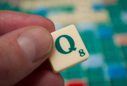 Letter "Q" tile from a Scrabble game