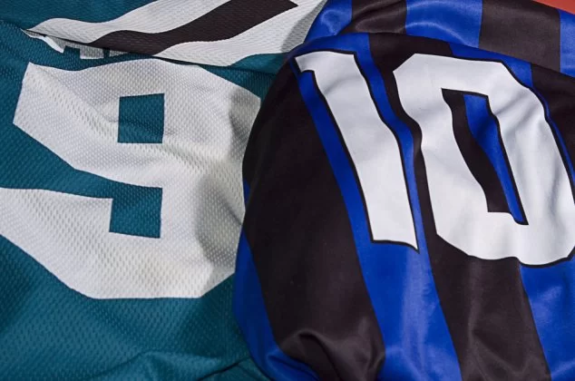 Close-up of a green jersey with the number "9" and blue/black striped jersey with the number "10"