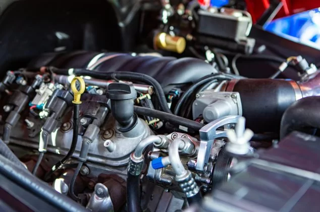 Close-up of car parts under the open hood