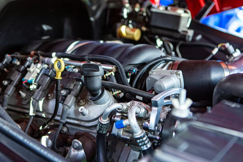 Close-up of car parts under the open hood