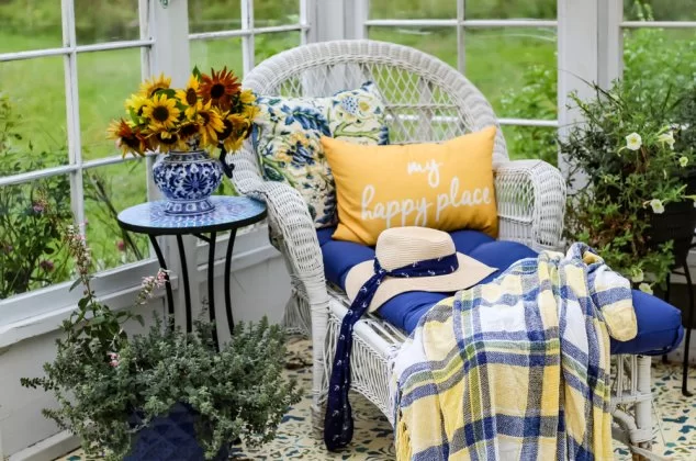 Wicker chair and flowers in a she shed