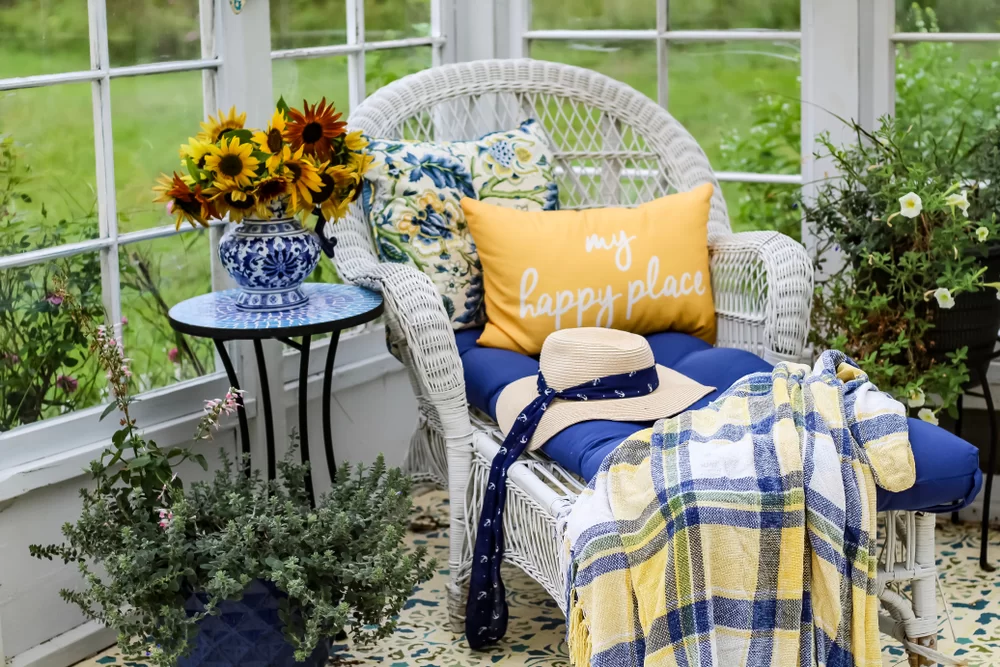 Wicker chair and flowers in a she shed