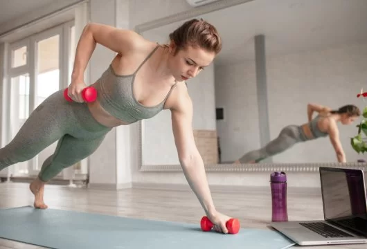 Woman doing an exercise with dumbbells