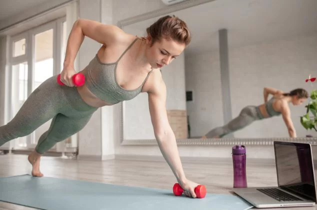 Woman doing an exercise with dumbbells
