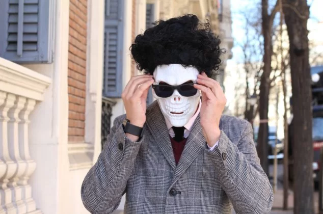person wearing a skeleton disguise and using a funny alias