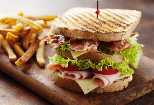 Club sandwich served with fries
