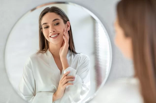 Selfish woman looking at her reflection in a mirror