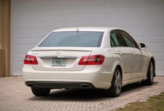 White car parked in a home's driveway