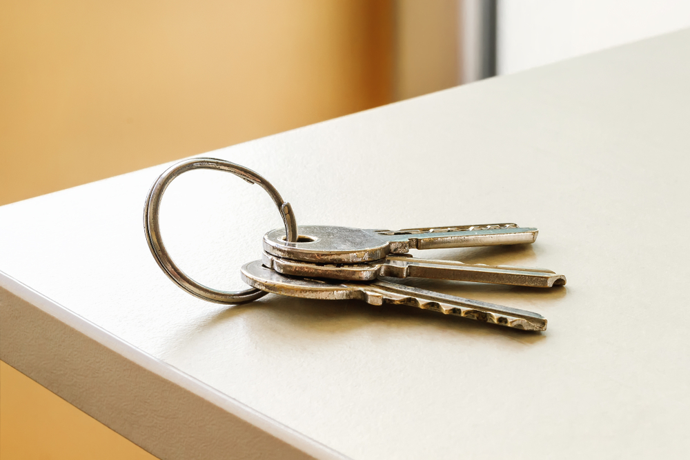 Keys, which start with "k," resting on a countertop
