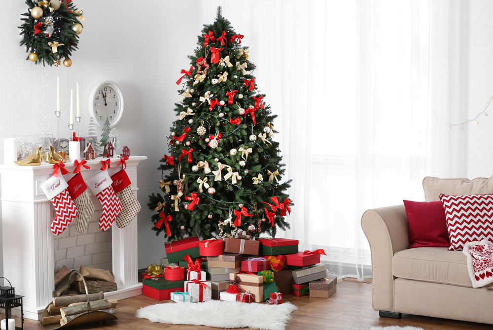 Living room decorated for Christmas with a tree and stockings