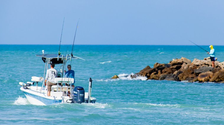 Small fishing boat heading out onto the water