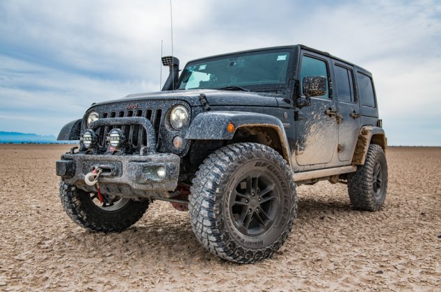 Muddy jeep pictured in the desert