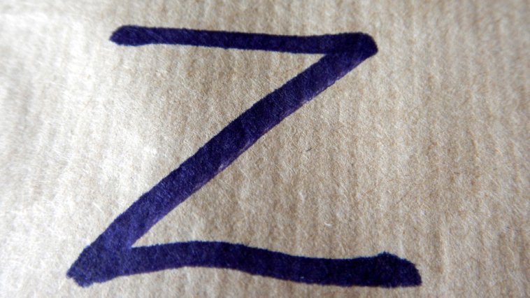 Letter "Z" written in blue marker on a white sheet of paper