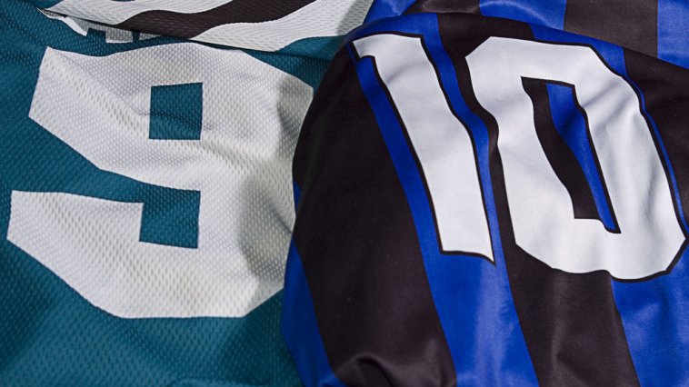 Close-up of a green jersey with the number "9" and blue/black striped jersey with the number "10"