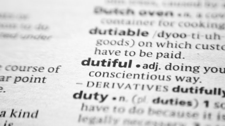 The character trait "dutiful" shown on a dictionary page