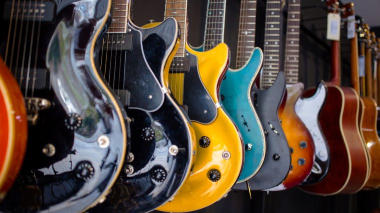 Guitars hanging on the wall of a music store