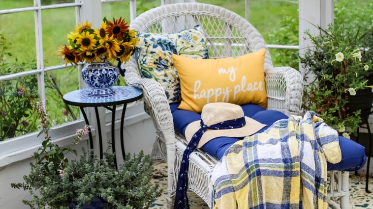 Wicker chair and flowers in a she shed