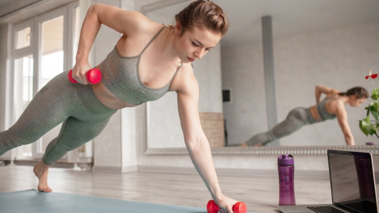 Woman doing an exercise with dumbbells