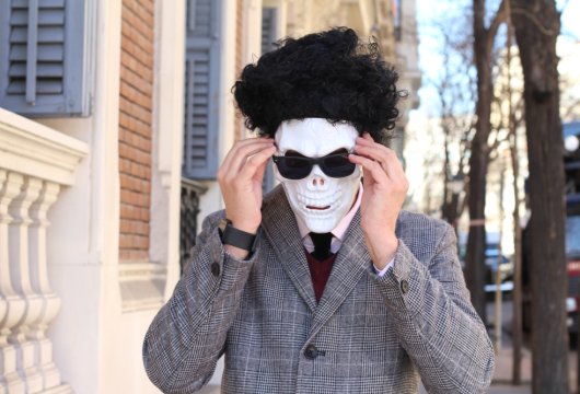 person wearing a skeleton disguise and using a funny alias