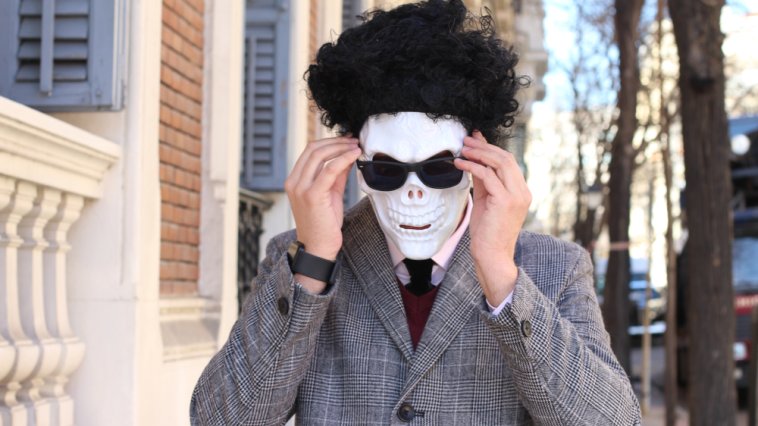 person wearing a skeleton disguise and using a funny alias