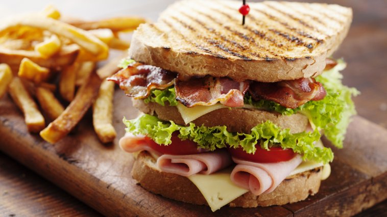 Club sandwich served with fries