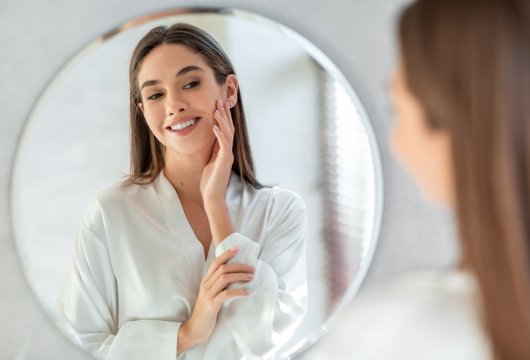Selfish woman looking at her reflection in a mirror