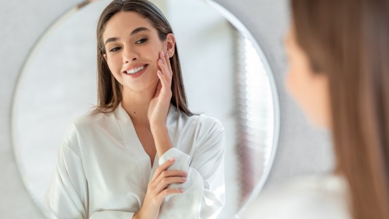 Selfish woman looking at her reflection in a mirror