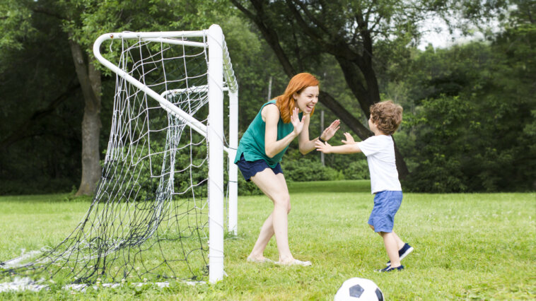 Soccer mom celebrating a good practice with her son