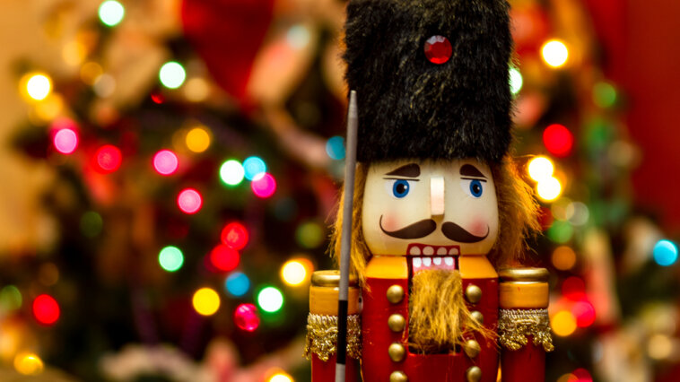 Soldier nutcracker pictured in front of Christmas lights